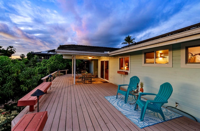 wooden deck featuring outdoor dining area