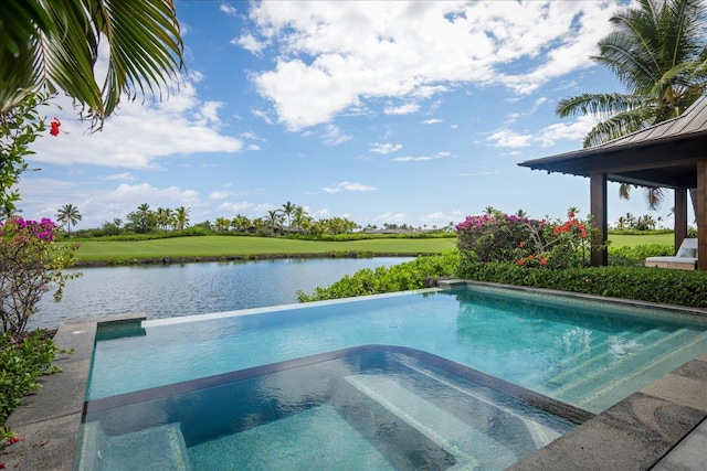 view of pool featuring an in ground hot tub and a water view