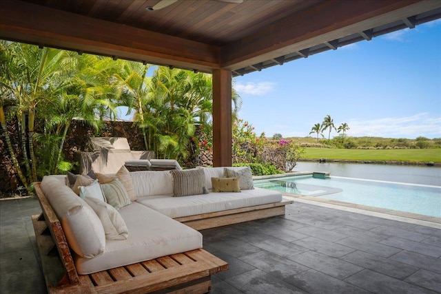 view of patio with a water view, an outdoor pool, and outdoor lounge area