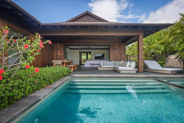 outdoor pool featuring an outdoor hangout area