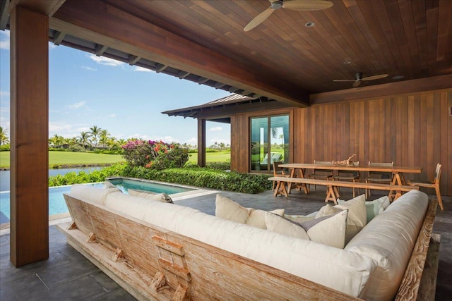 view of patio with an outdoor living space, outdoor dining area, ceiling fan, a water view, and an in ground hot tub