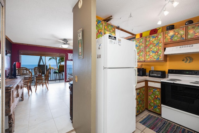 kitchen featuring white appliances, under cabinet range hood, a textured ceiling, a ceiling fan, and light tile patterned floors