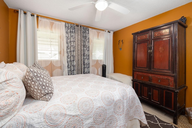 carpeted bedroom with a ceiling fan
