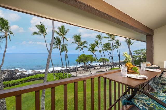 balcony featuring a water view