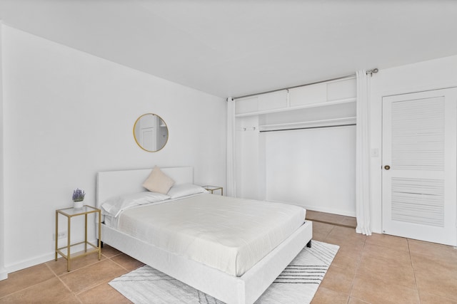 bedroom with light tile patterned floors