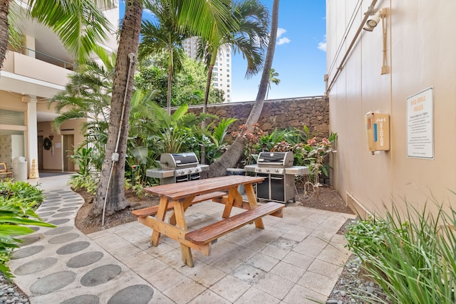 view of patio / terrace featuring a grill and outdoor dining space