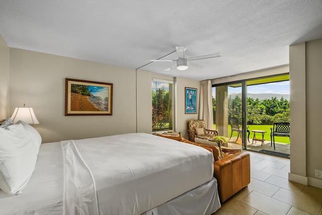 5380 Honoiki Rd Unit F16, Princeville, HI 96722 - bedroom featuring access to exterior, light tile patterned flooring, and a ceiling fan
