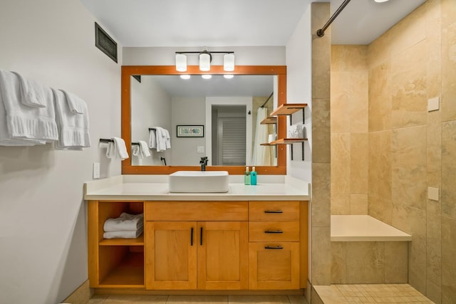 5380 Honoiki Rd Unit F16, Princeville, HI 96722 - full bath with a tile shower, vanity, and tile patterned floors