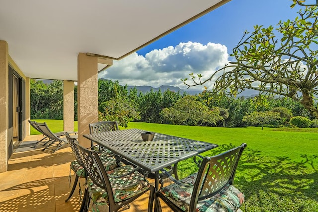 5380 Honoiki Rd Unit F16, Princeville, HI 96722 - view of patio with outdoor dining area and a mountain view