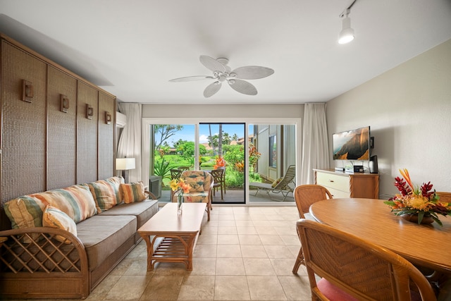 living room featuring a ceiling fan and light tile patterned floors