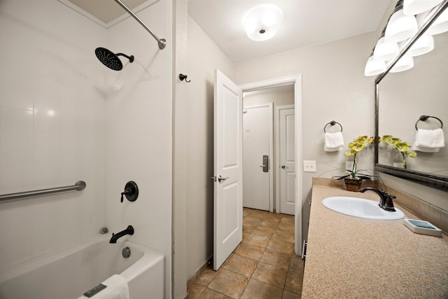 full bath featuring shower / bathtub combination, vanity, and stone finish flooring