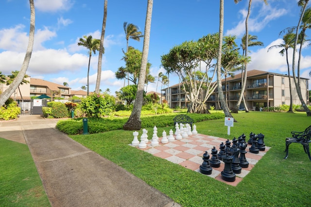 view of property's community featuring a yard
