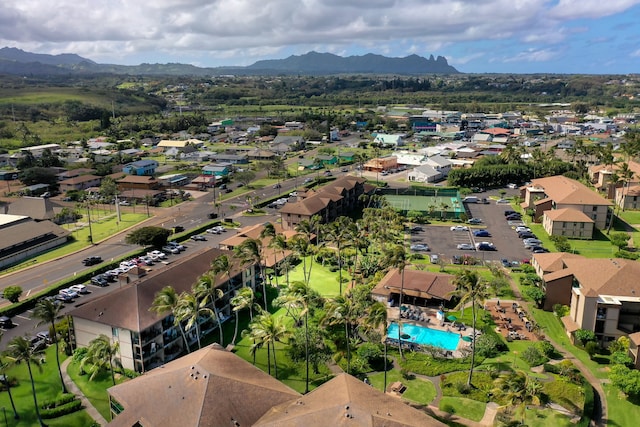 aerial overview of property's location featuring mountains and nearby suburban area