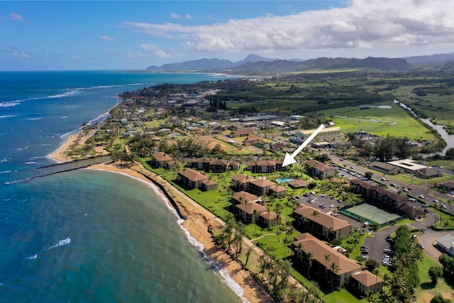 aerial view of property and surrounding area featuring a water and mountain view