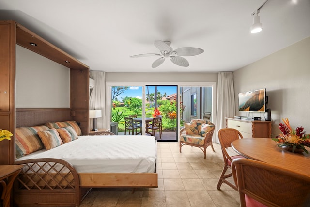 bedroom with access to outside and a ceiling fan