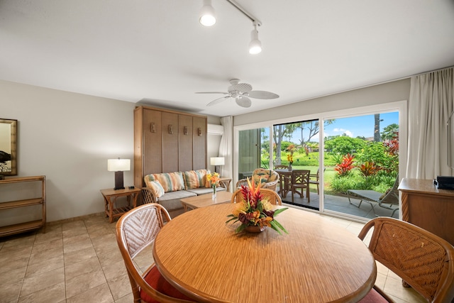 dining area with a ceiling fan and light tile patterned flooring