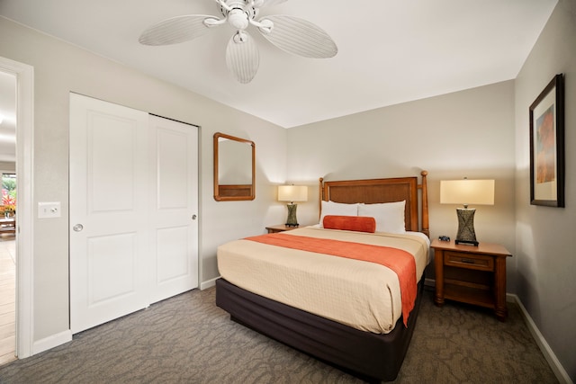 carpeted bedroom featuring baseboards and a ceiling fan