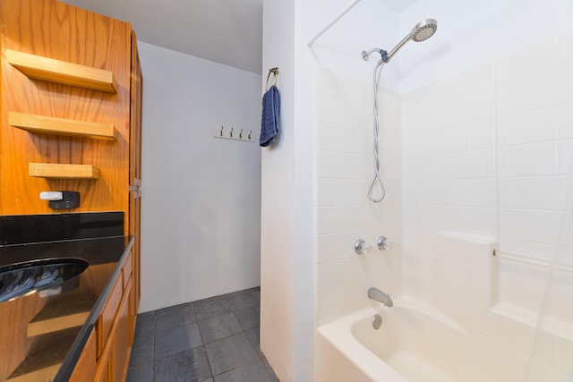 full bathroom with a sink, tile patterned floors, and shower / bath combination
