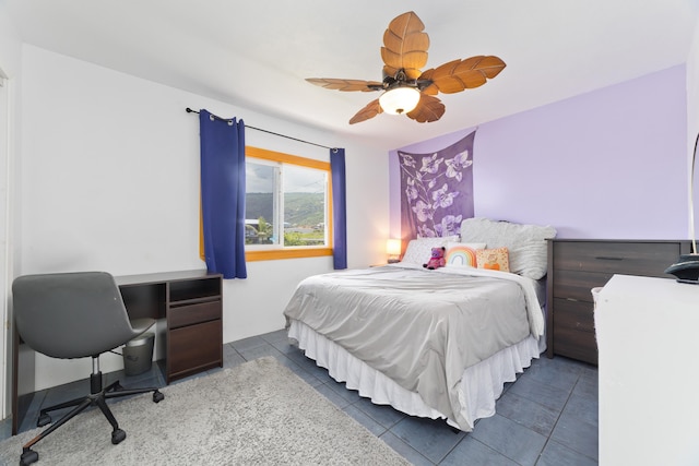 tiled bedroom with ceiling fan