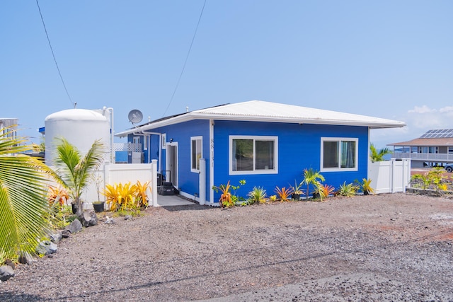 view of front of house featuring fence
