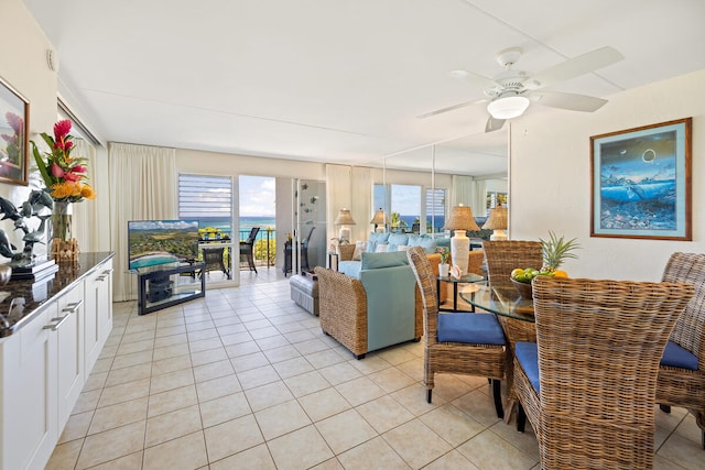 living room featuring light tile patterned floors and a ceiling fan