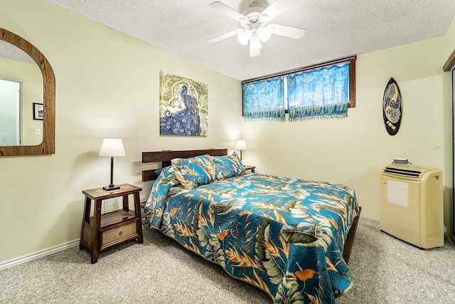 carpeted bedroom featuring a textured ceiling and a ceiling fan