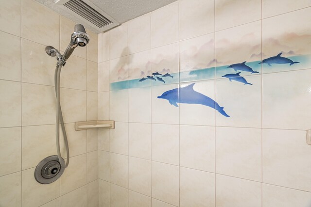 full bath with a tile shower