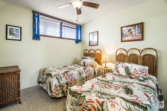 carpeted bedroom with a textured ceiling and ceiling fan
