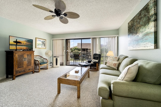 carpeted living room featuring a textured ceiling and ceiling fan