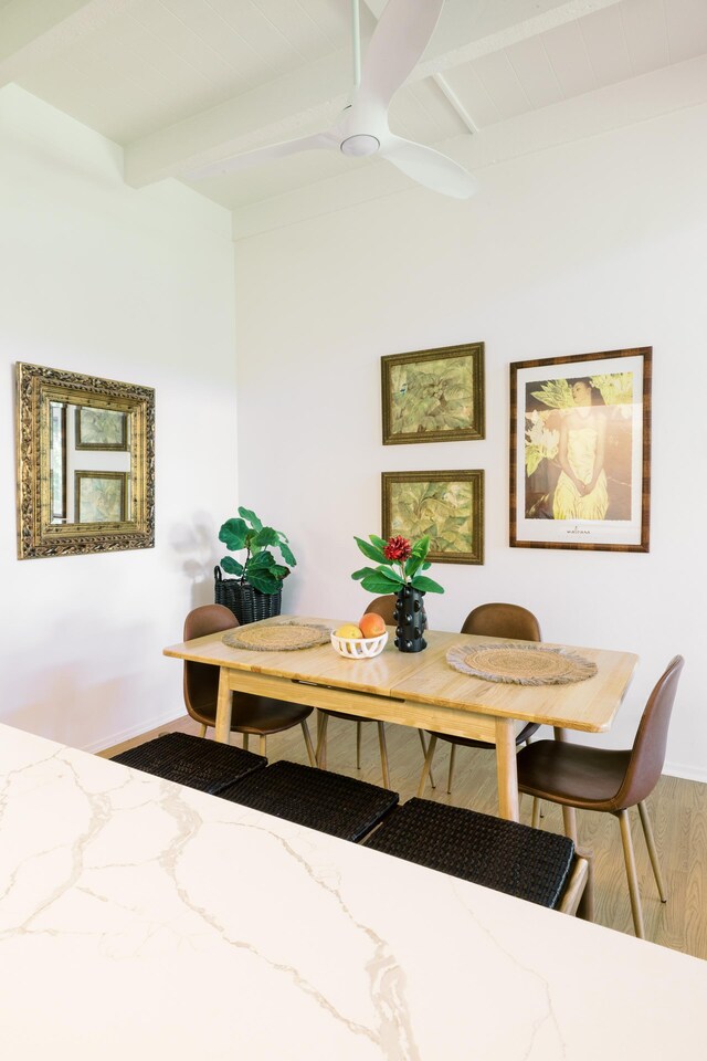 3880 Wyllie Rd Unit 5A, Princeville, HI 96722 - dining space featuring wood finished floors, beam ceiling, baseboards, and a ceiling fan