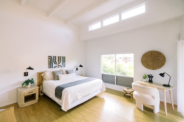3880 Wyllie Rd Unit 5A, Princeville, HI 96722 - bedroom with beamed ceiling, wood finished floors, a towering ceiling, and baseboards