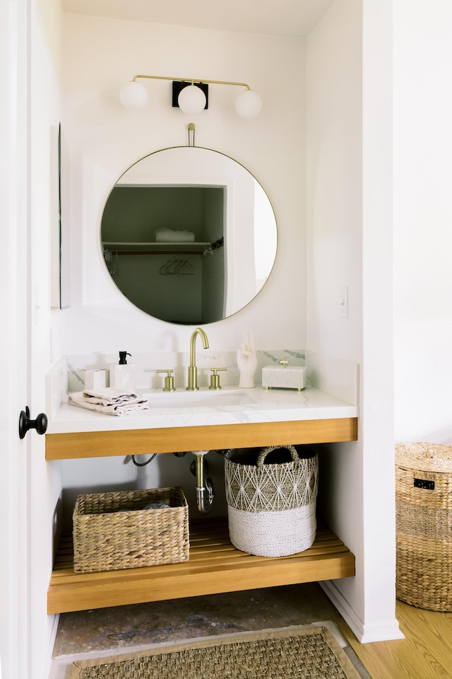 3880 Wyllie Rd Unit 5A, Princeville, HI 96722 - bathroom with wood finished floors and a sink