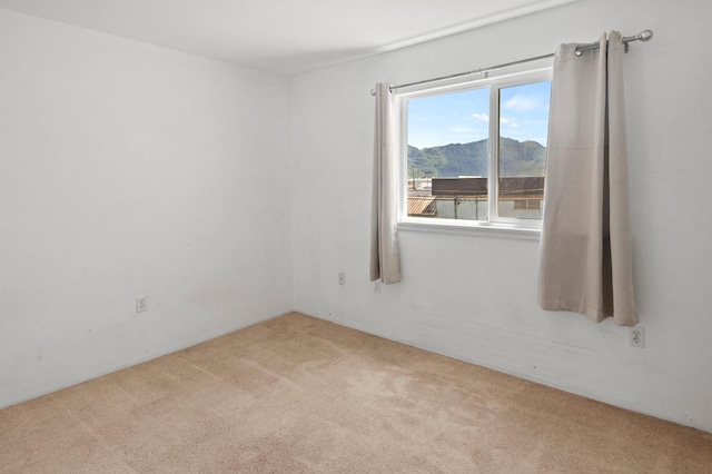 3920 Haoa St Unit 322, Lihue, HI 96766 - spare room featuring carpet floors and a mountain view