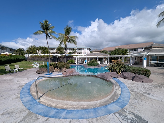 community pool featuring a patio