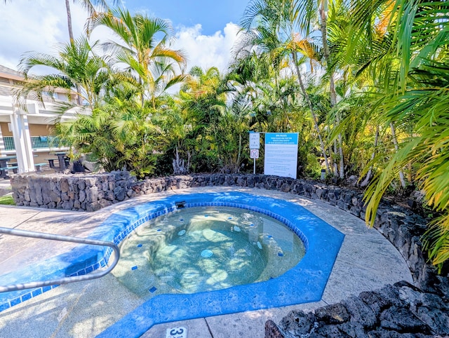 view of pool with a community hot tub