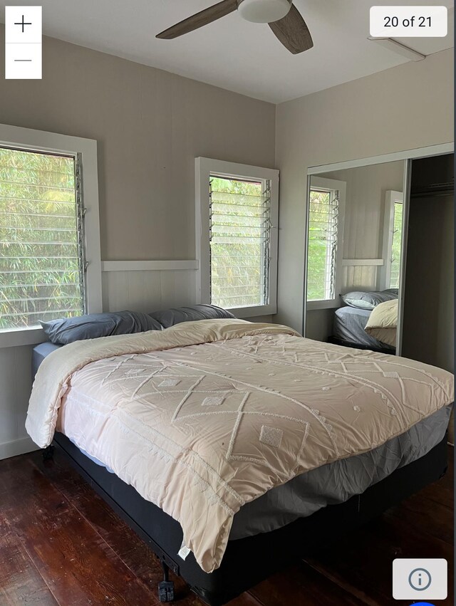 bedroom featuring dark wood-style flooring and ceiling fan