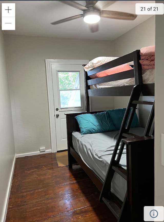 bedroom featuring dark wood-style flooring, baseboards, and ceiling fan