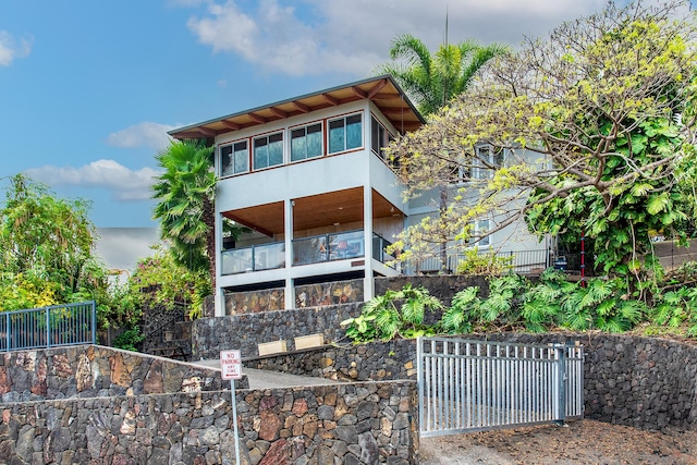 back of property featuring fence