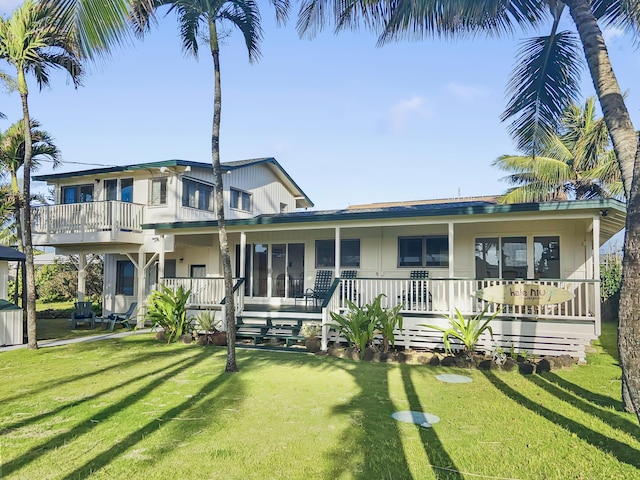 963 Niulani Rd, Kapaa, HI 96746 - view of front of house with a front yard, a porch, and a balcony