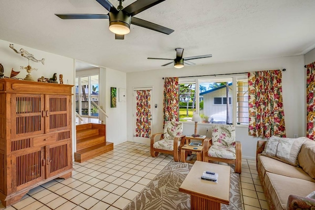 963 Niulani Rd, Kapaa, HI 96746 - living room with a ceiling fan, stairway, light tile patterned floors, a textured ceiling, and baseboards