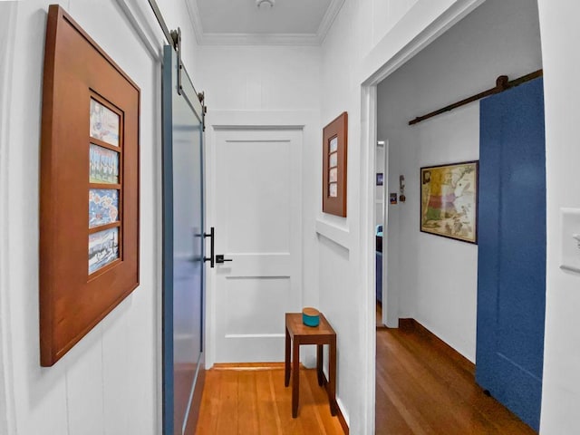 4-950 Kuhio Hwy, Kapaa, HI 96746 - corridor featuring a barn door, wood finished floors, and ornamental molding
