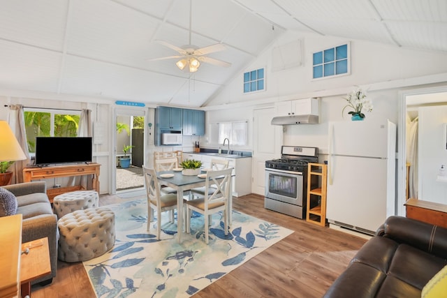 4-950 Kuhio Hwy, Kapaa, HI 96746 - living area with a ceiling fan, light wood-style flooring, and high vaulted ceiling