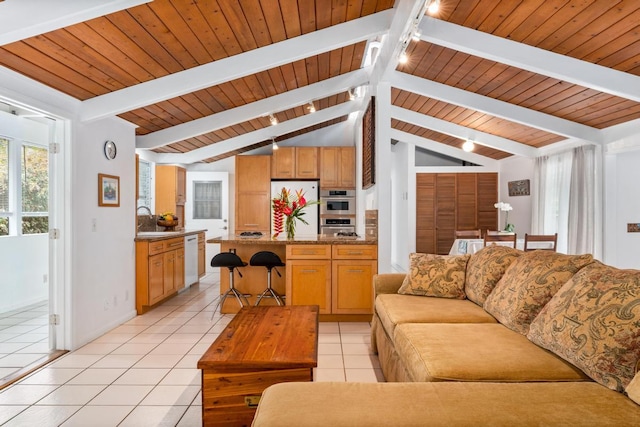 living room featuring rail lighting, light tile patterned flooring, wood ceiling, and baseboards
