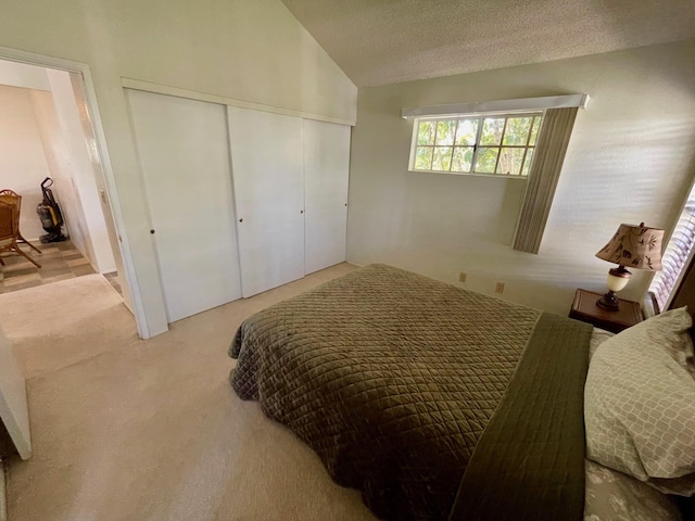 68-3883 Lua Kula St Unit 2005, Waikoloa, HI 96738 - bedroom with carpet floors, a closet, lofted ceiling, and a textured ceiling