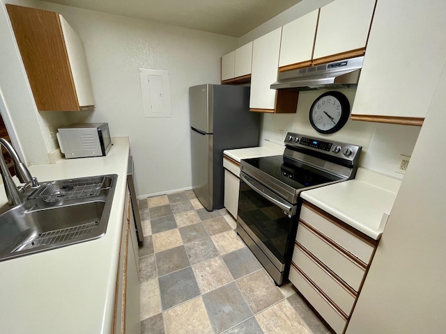 68-3883 Lua Kula St Unit 2005, Waikoloa, HI 96738 - kitchen featuring under cabinet range hood, appliances with stainless steel finishes, a sink, stone finish floors, and light countertops