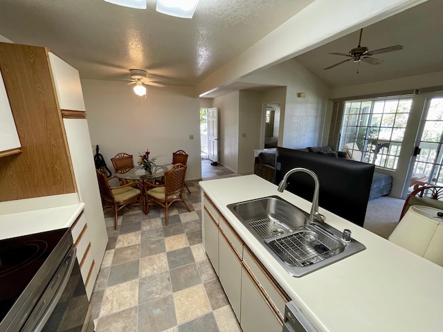 68-3883 Lua Kula St Unit 2005, Waikoloa, HI 96738 - kitchen featuring a sink, a ceiling fan, light countertops, and a textured ceiling