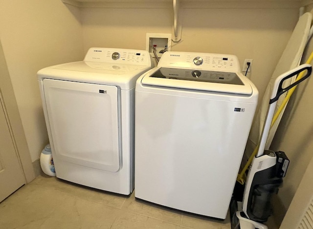 69-1033 Nawahine Pl Unit 10F, Waikoloa, HI 96738 - laundry area featuring washing machine and clothes dryer