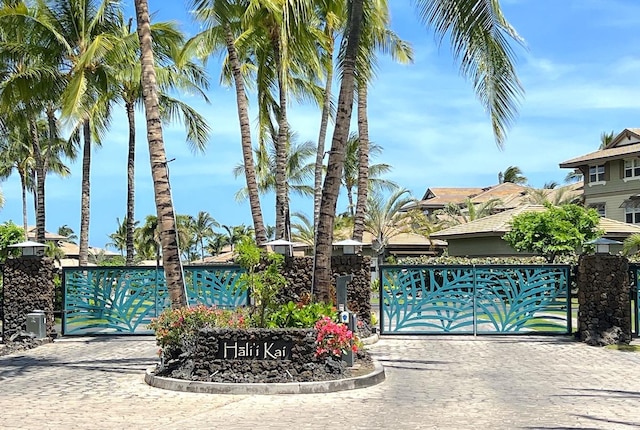 69-1033 Nawahine Pl Unit 10F, Waikoloa, HI 96738 - community / neighborhood sign featuring a gate and decorative driveway
