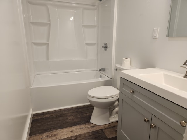full bathroom with wood finished floors, toilet, shower / bathtub combination, and vanity