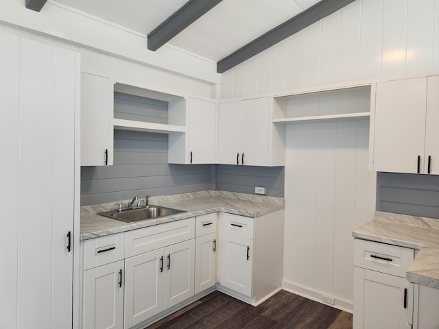 kitchen featuring open shelves, a sink, dark wood-style floors, light countertops, and white cabinetry
